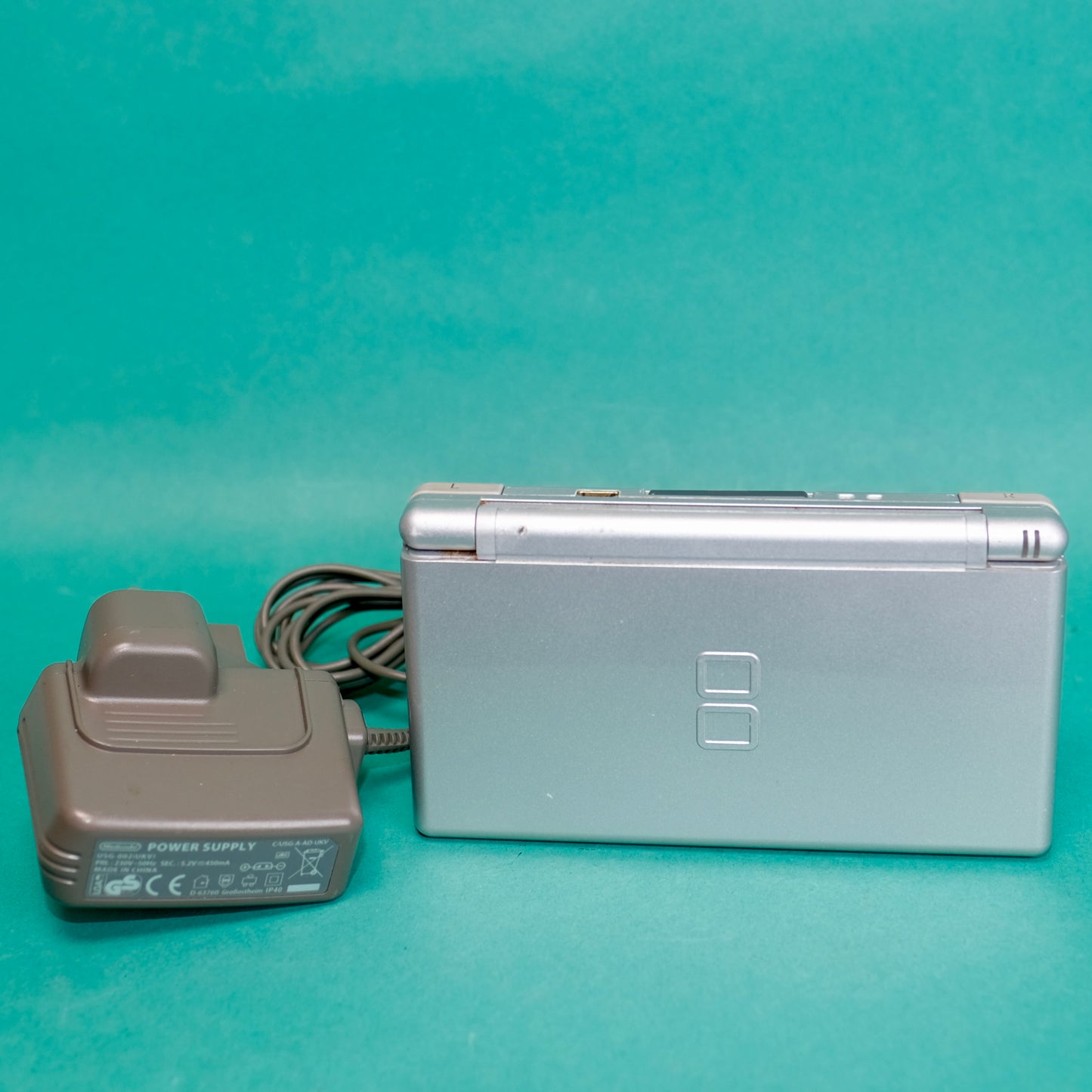Nintendo DS lite, silver, with original charger defect